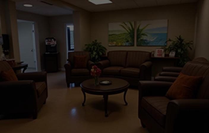 Comfortable customer waiting lounge at King Triton Car Care Center with coffee bar